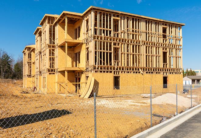 construction zone secured with a temporary fence, marked with warning signs in Keansburg, NJ